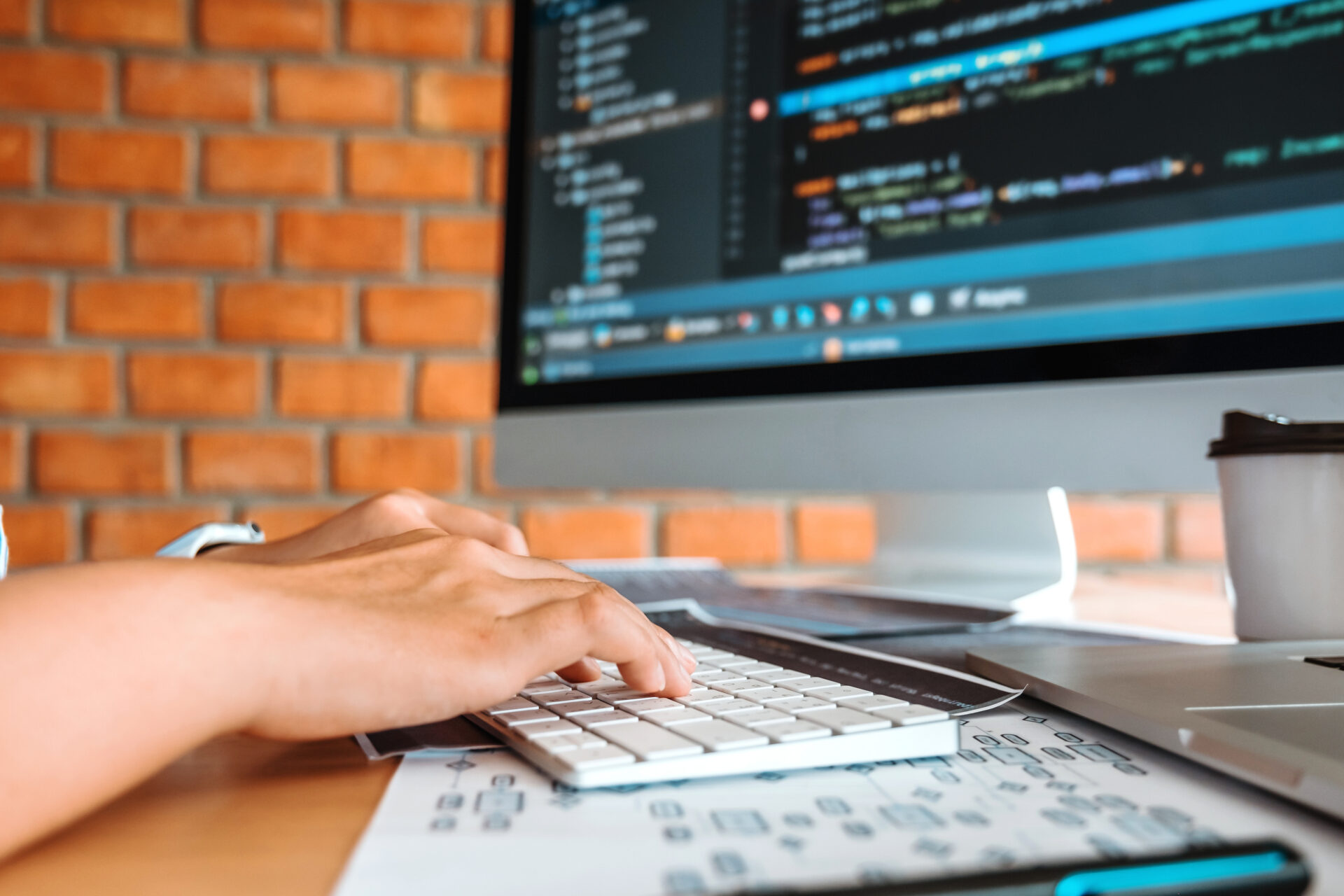 Developing Concentrated programmer reading computer codes Development Website design and coding technologies.